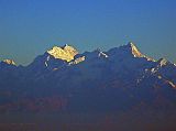 Manaslu 00 01 Manaslu From Flight To Kathmandu I watched in anticipation as the glow of the pre-dawn sun illuminated the silhouette of the Himalayan Mountains as my flight approached Kathmandu. The pilot announced that we would have to circle around Kathmandu because of low cloud cover. We had a beautiful early morning view of the sunny east face of Manaslu leading down to Ngadi Chuli (7871m, also known as Peak 29) and to the right Himal Chuli (7893m).